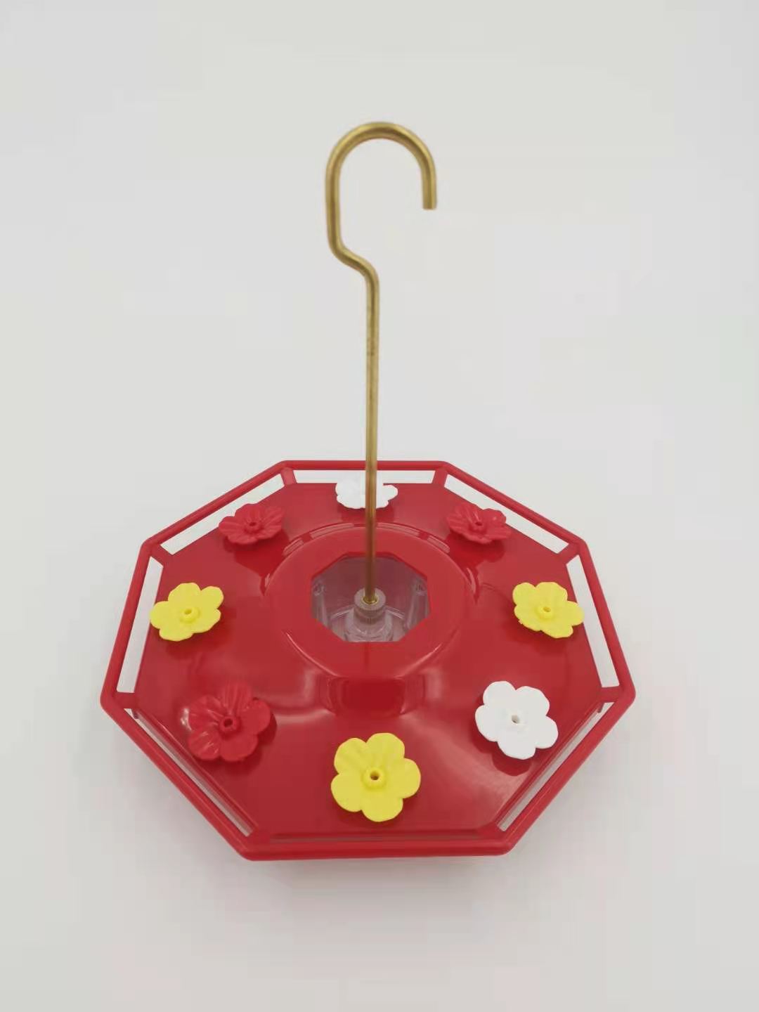 Red saucer hummingbird feeder with flower ports